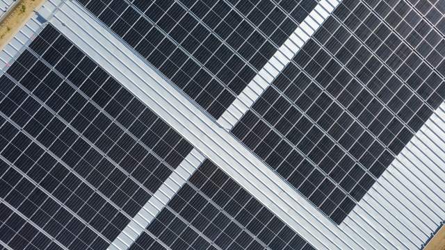 Close overhead detail of panel rows across the reservoir cover