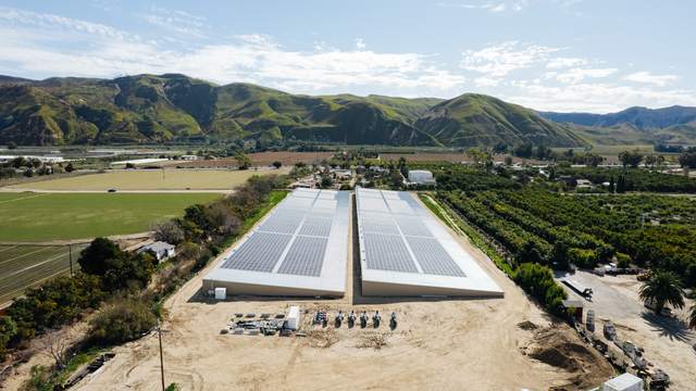 Both covers with equipment yard and orchards to the east