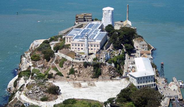 Aerial of Alcatraz Island with a rooftop solar array on the main cellhouse