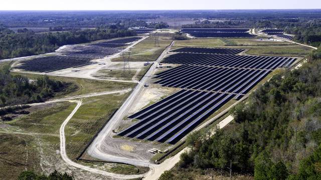 Aerial of long solar rows following the contour of the land