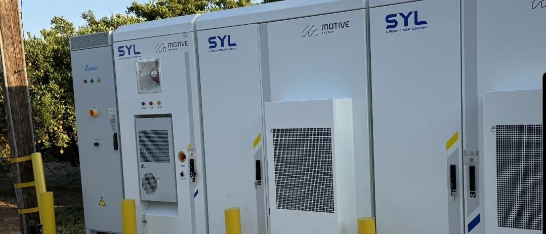 Close view of battery cabinets behind yellow bollards